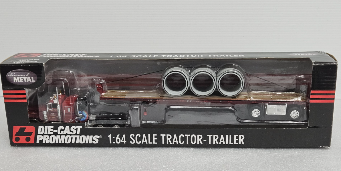 Peterbuilt 379 Flattop with 3 (72) Drain Pipe Load on Wilson Flatbed 1:64