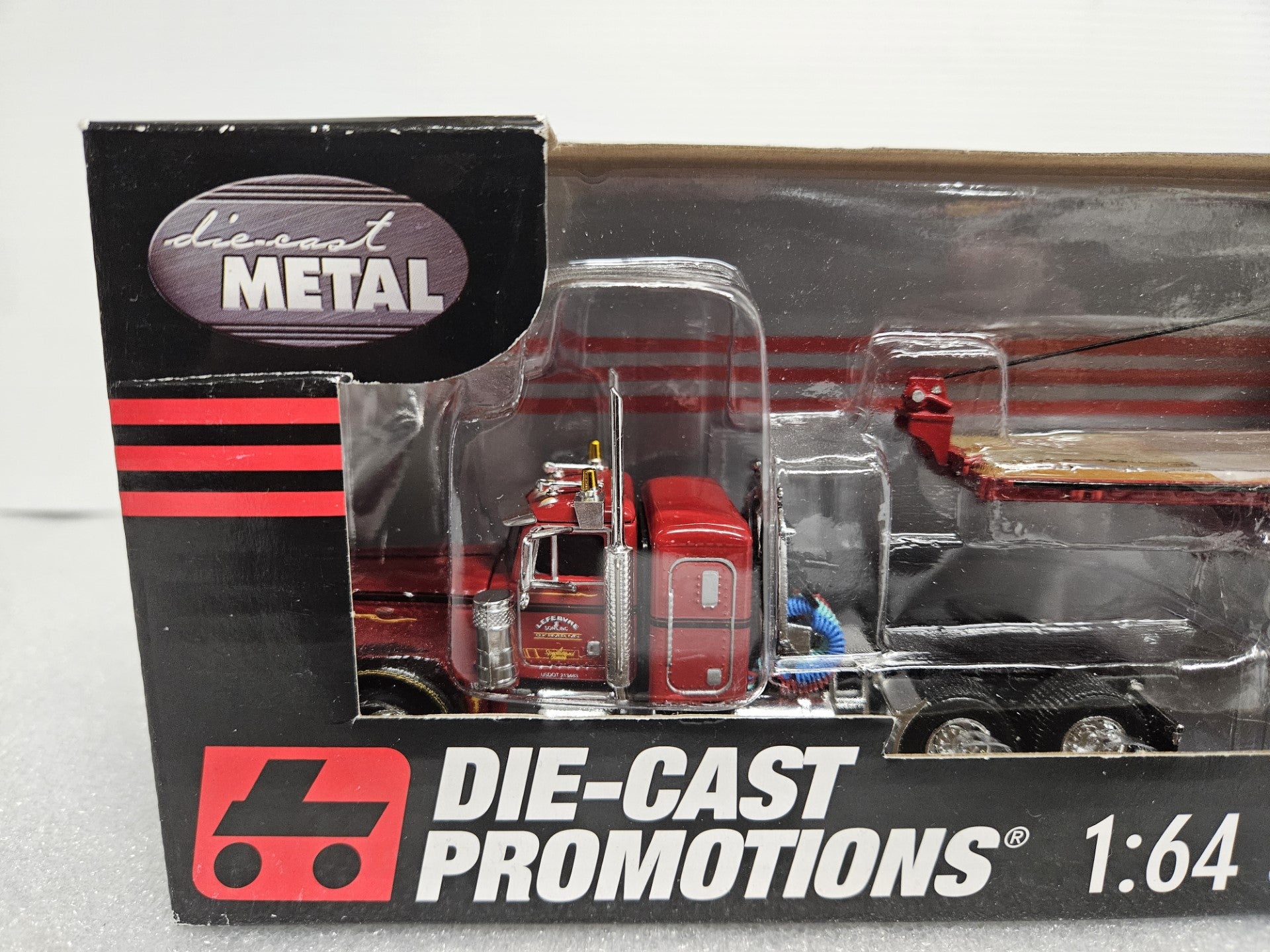 Peterbuilt 379 Flattop with 3 (72) Drain Pipe Load on Wilson Flatbed 1:64