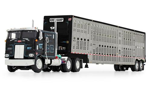 KREILKAMP TRUCKING BLACK PETERBILT MODEL 352 COE 110" BUNK WITH WILSON SILVERSTAR TANDEM AXLE LIVESTOCK TRAILER