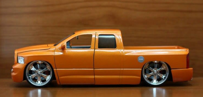 2003 DODGE RAM ORANGE WITH KMC WHEELS, VERSION DUB CITY, 1:24