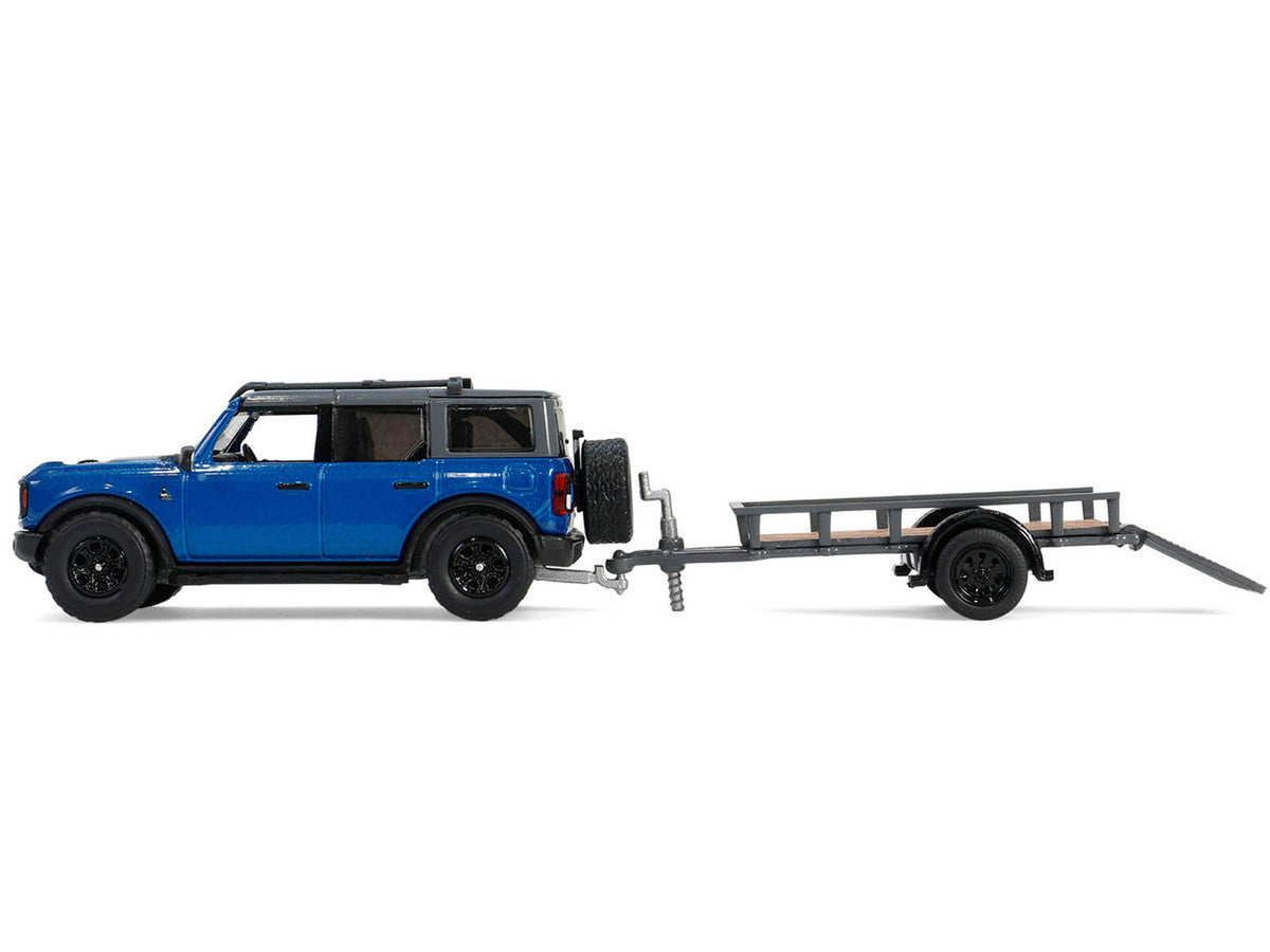 2021 Ford Bronco Black Diamond in Velocity Blue GL32320-C Metallic with Utility Trailer and Motorcycle