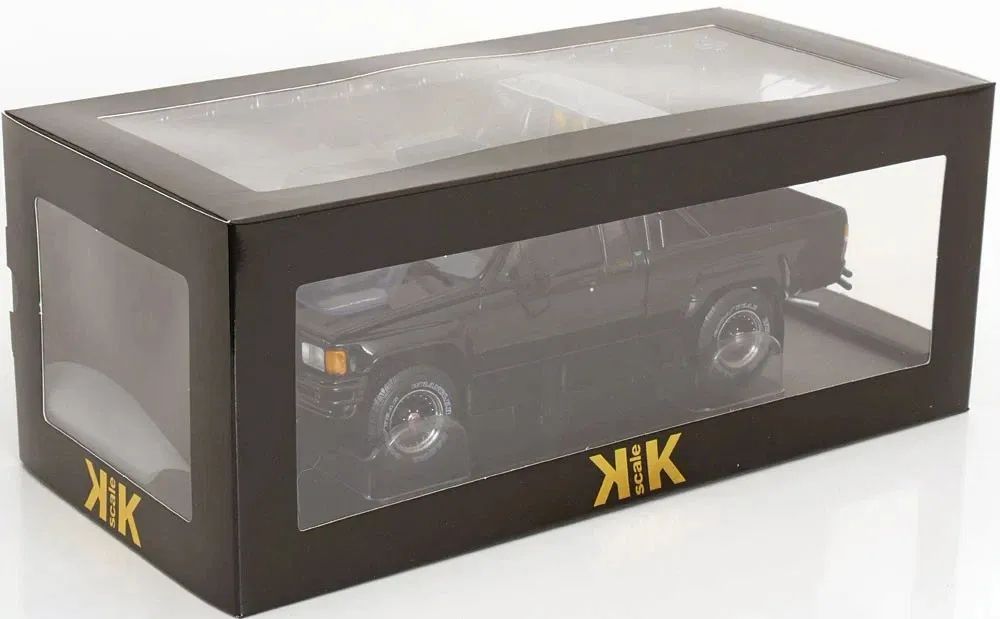 (PRE-ORDER: OCTOBER 2026) KK Scale 1:18 1985 Toyota Hilux SR5 Xtra Cab 4x4 – Back to the Future (1985) + Marty McFly Figure Bundle – KKDC181561-KKFIG024