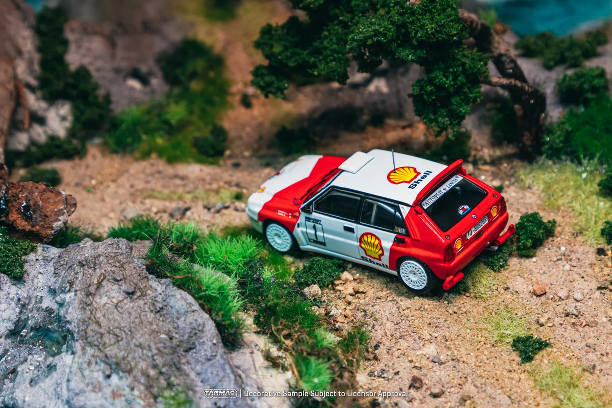Tarmac Works Hobby64 1:64 Lancia Delta HF Integrale – Vainqueur Mogürt-Salgó Rallye 1993 – László Sen Ranga / Ernő Büki – T64-049-93MSR01