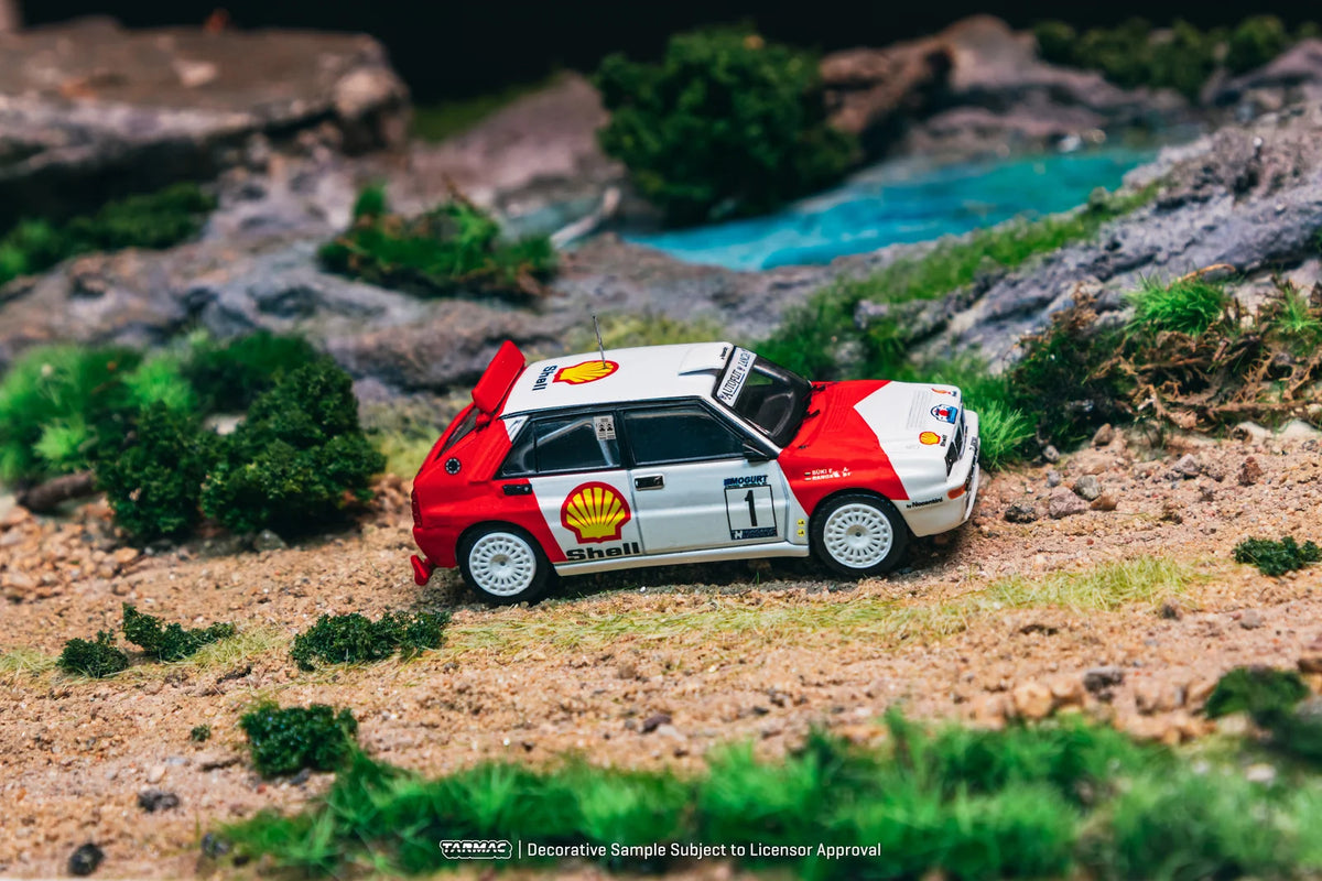 Tarmac Works Hobby64 1:64 Lancia Delta HF Integrale – Vainqueur Mogürt-Salgó Rallye 1993 – László Sen Ranga / Ernő Büki – T64-049-93MSR01