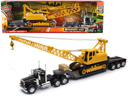 Kenworth W900 avec remorque surbaissée transportant une grue sur chenilles